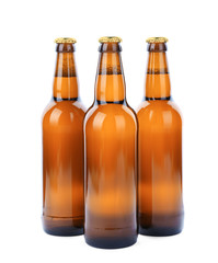 Glass bottles of beer isolated on white