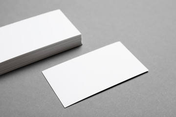 Blank business cards on grey background