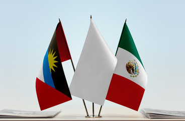 Flags of Antigua and Barbuda and Mexico with a white flag in the middle