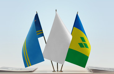 Flags of Aruba and Saint Vincent and the Grenadines with a white flag in the middle