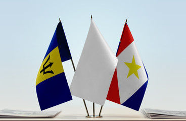 Flags of Barbados and Saba with a white flag in the middle