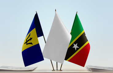 Flags of Barbados and Saint Kitts and Nevis with a white flag in the middle