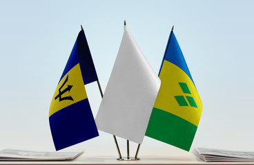 Flags of Barbados and Saint Vincent and the Grenadines with a white flag in the middle