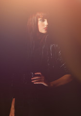 Glamorous modern young woman in a black leather jacket