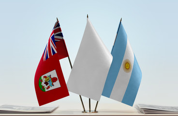 Flags of Bermuda and Argentina with a white flag in the middle