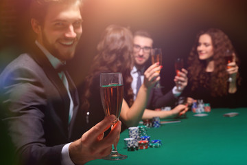 poker player with a glass of wine