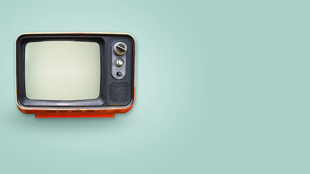 Retro television - old vintage tv on color background. retro technology. flat lay, top view hero header. vintage color styles.