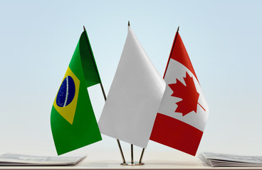 Flags of Brazil and Canada with a white flag in the middle