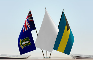 Flags of British Virgin Islands and Bahamas with a white flag in the middle