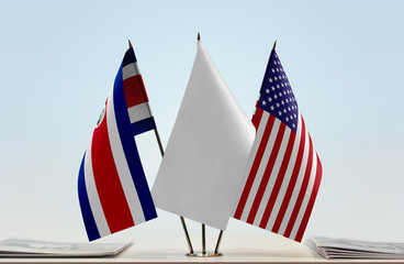 Flags of Costa Rica and USA with a white flag in the middle