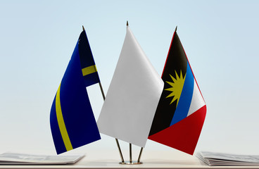 Flags of Curacao and Antigua and Barbuda with a white flag in the middle