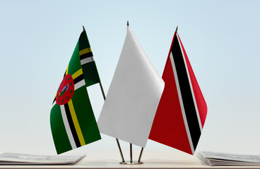 Flags of Dominica and Trinidad and Tobago with a white flag in the middle