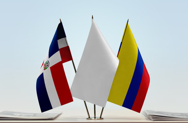 Flags of Dominican Republic and Colombia with a white flag in the middle