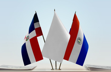 Flags of Dominican Republic and Paraguay with a white flag in the middle