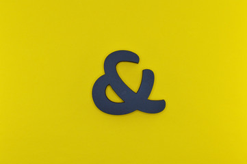 black bold ampersand on yellow background