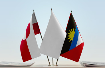 Flags of Greenland and Antigua and Barbuda with a white flag in the middle