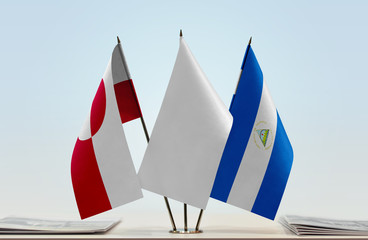 Flags of Greenland and Nicaragua with a white flag in the middle