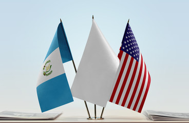 Flags of Guatemala and USA with a white flag in the middle