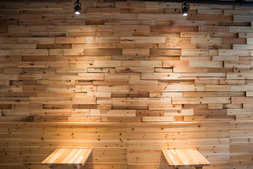 Planks brown wooden panel wall with two dimming downlight lights