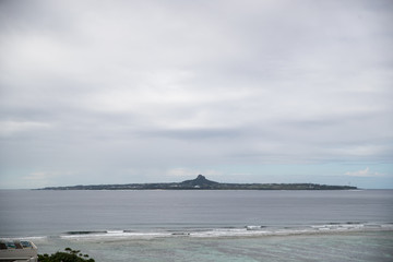 small island with mountains and sky