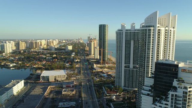Aerial reveal condominium development Sunny Isles Beach Florida drone footage