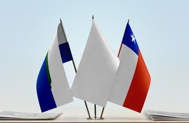 Flags of Navassa Island and Chile with a white flag in the middle