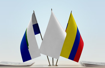 Flags of Navassa Island and Colombia with a white flag in the middle