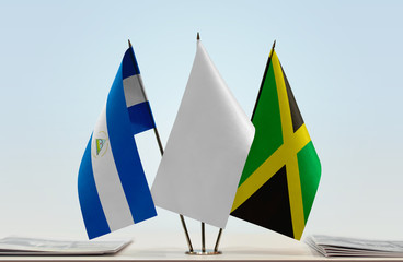 Flags of Nicaragua and Jamaica with a white flag in the middle