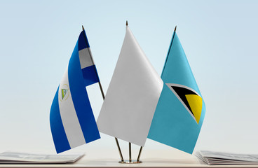 Flags of Nicaragua and Saint Lucia with a white flag in the middle