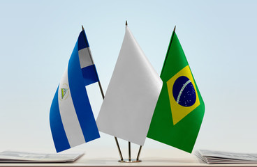 Flags of Nicaragua and Brazil with a white flag in the middle