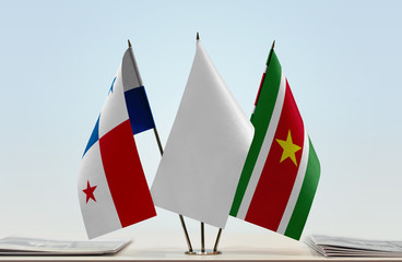 Flags of Panama and Suriname with a white flag in the middle