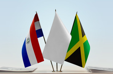 Flags of Paraguay and Jamaica with a white flag in the middle