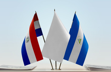 Flags of Paraguay and Nicaragua with a white flag in the middle