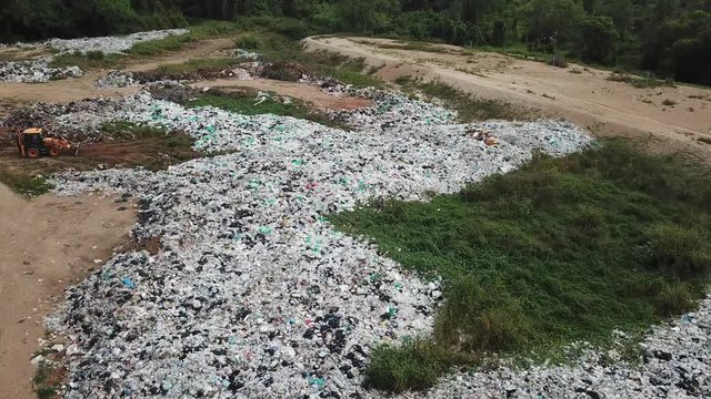 Plastic pollution - landfill garbage dump. Plastic bags and bottles pollute the environment