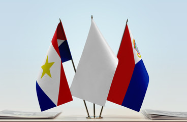 Flags of Saba and Sint Maarten with a white flag in the middle