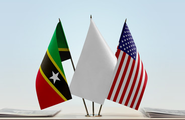 Flags of Saint Kitts and Nevis and USA with a white flag in the middle