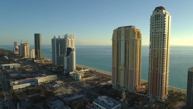 Drone approach highrise condominium apartment buildings Sunny Isles Beach FL USA