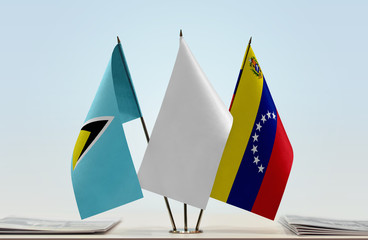 Flags of Saint Lucia and Venezuela with a white flag in the middle