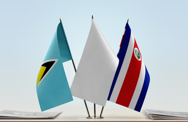 Flags of Saint Lucia and Costa Rica with a white flag in the middle