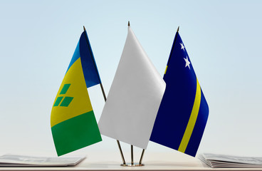 Flags of Saint Vincent and the Grenadines and Curacao with a white flag in the middle