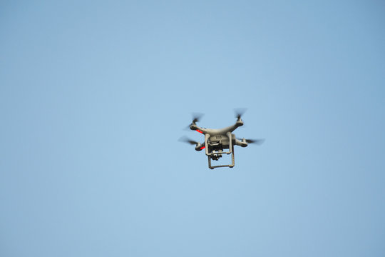 Surveillance drone flying on sky i