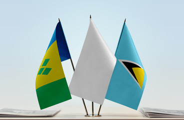 Flags of Saint Vincent and the Grenadines and Saint Lucia with a white flag in the middle