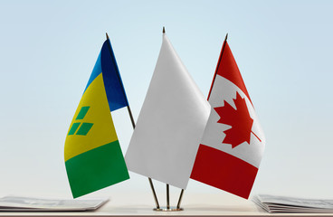 Flags of Saint Vincent and the Grenadines and Canada with a white flag in the middle