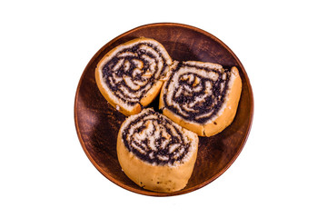 Ceramic plate with poppy seed buns isolated on a white background