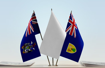 Flags of South Georgia and Sandwich and Turks and Caicos Islands with a white flag in the middle