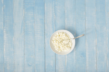 Healthy breakfast. Plate cottage cheese copy space, top view