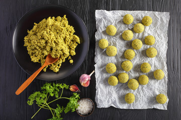 raw falafel balls and ground chickpea mix