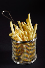 french fries on black background