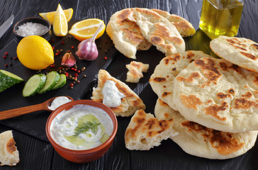 freshly baked pita bread with yogurt sauce