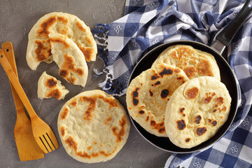pita bread in skillet on concrete table